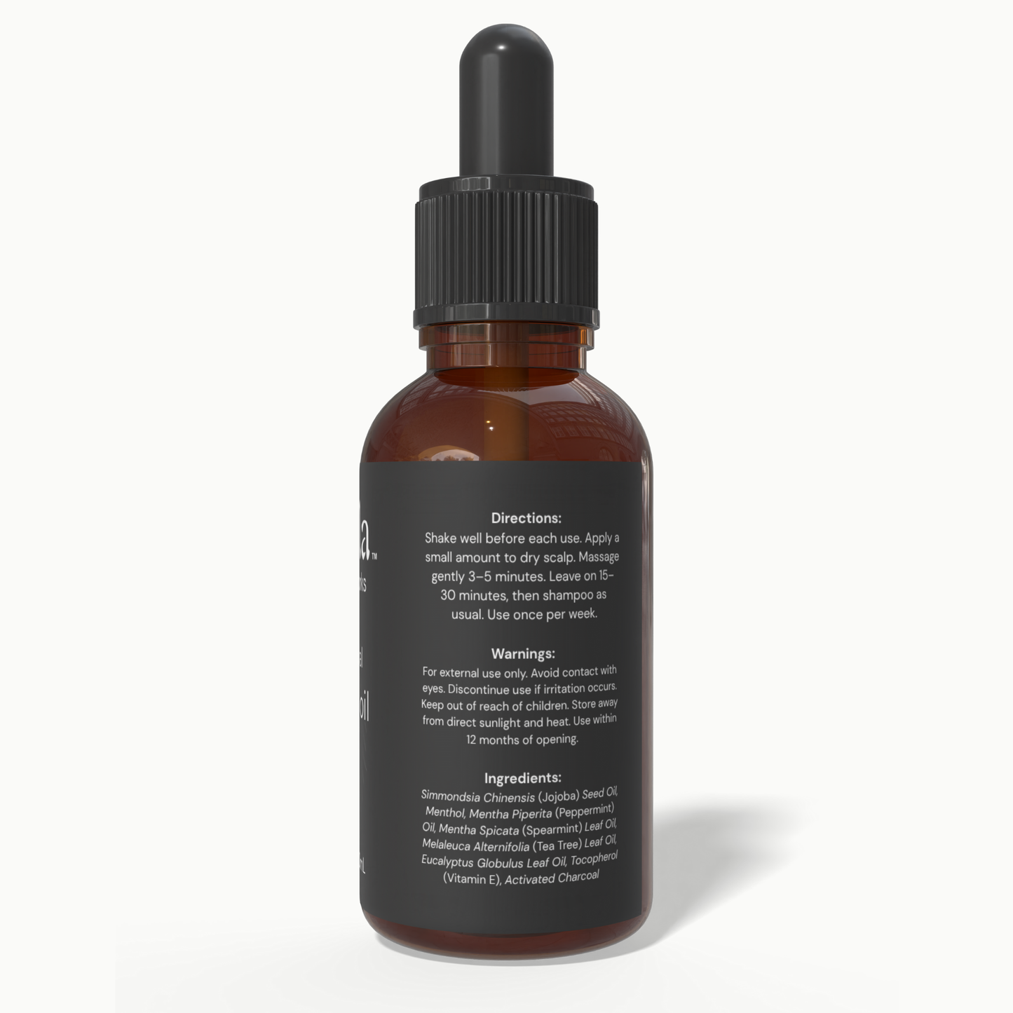 Back label of Beela Charcoal Detox Scalp Oil with usage directions, warnings, and ingredient list including charcoal, peppermint, and tea tree.
