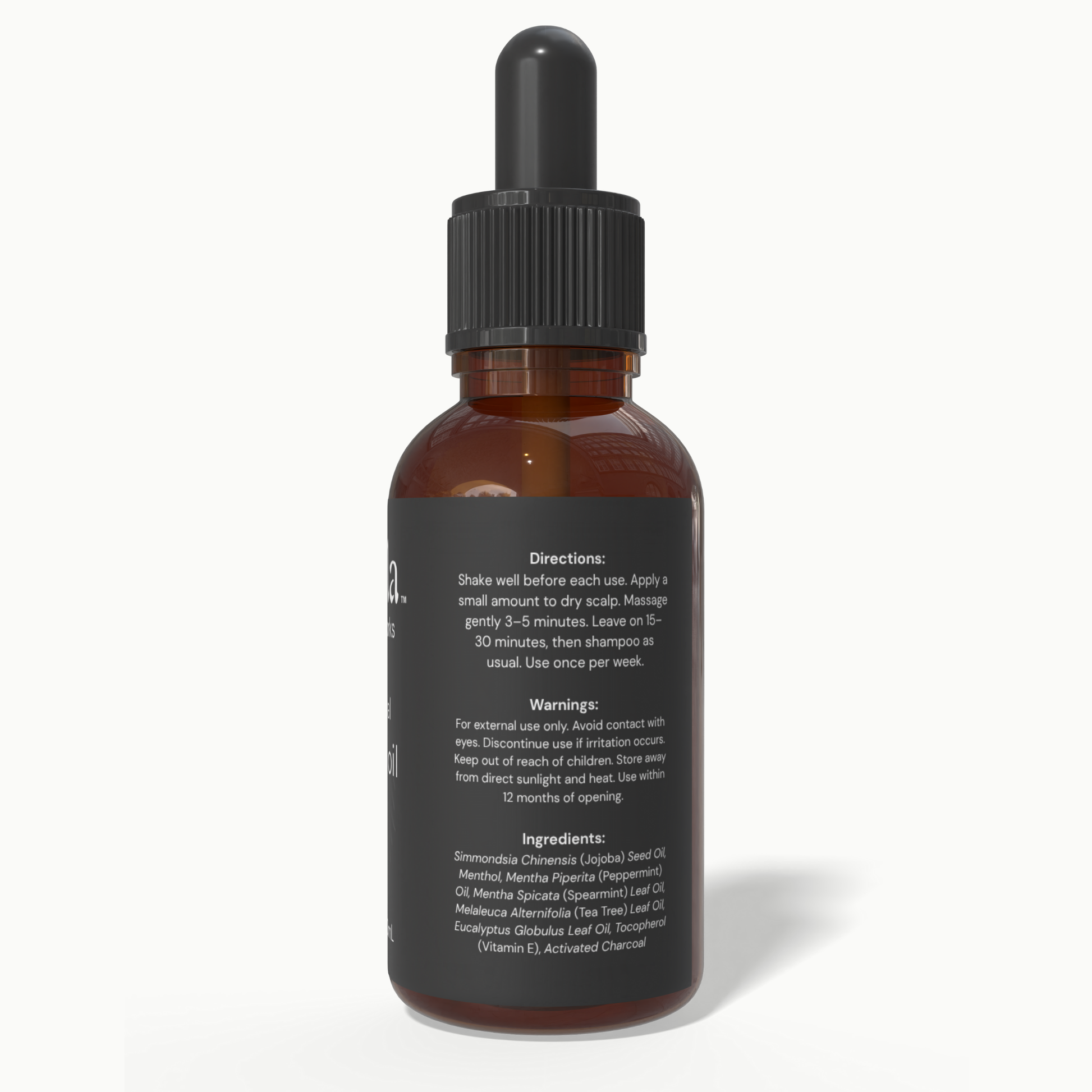 Back label of Beela Charcoal Detox Scalp Oil with usage directions, warnings, and ingredient list including charcoal, peppermint, and tea tree.